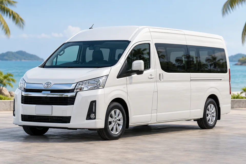 Illustrative white Toyota Commuter passenger van by the Samui coast